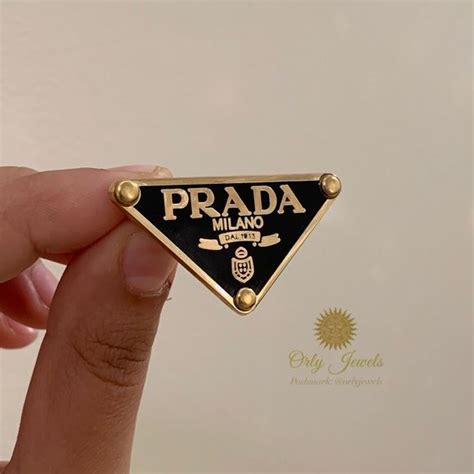 prada lapel pin.